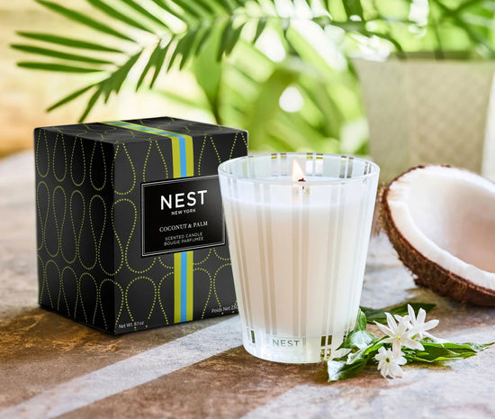 Photo of Coconut and Palm Candle in a decorative scene, designed by , available at Plumb Gold & Plumb Silver