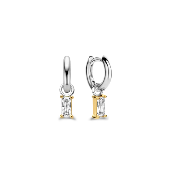 Photo of Cubic Zirconia Baguette Dangle Earrings in a decorative scene, designed by , available at Plumb Gold & Plumb Silver