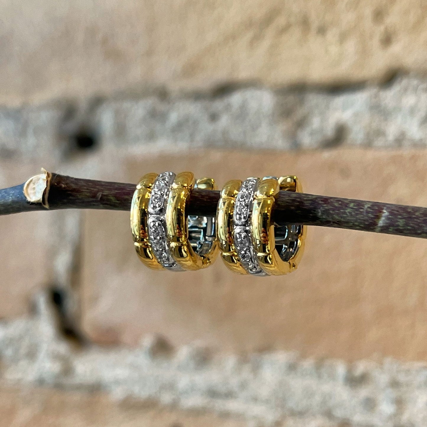 Photo of Cubic Zirconia Fancy Link Hoops in a decorative scene, designed by , available at Plumb Gold & Plumb Silver