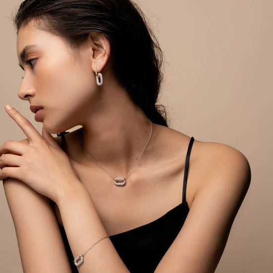 Photo of Cubic Zirconia Oval Necklace in a decorative scene, designed by , available at Plumb Gold & Plumb Silver