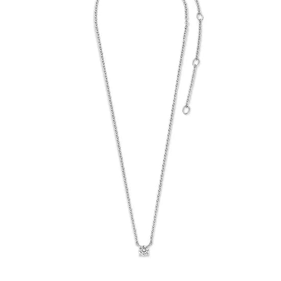 Photo of Cubic Zirconia Solitaire Necklace in a decorative scene, designed by , available at Plumb Gold & Plumb Silver