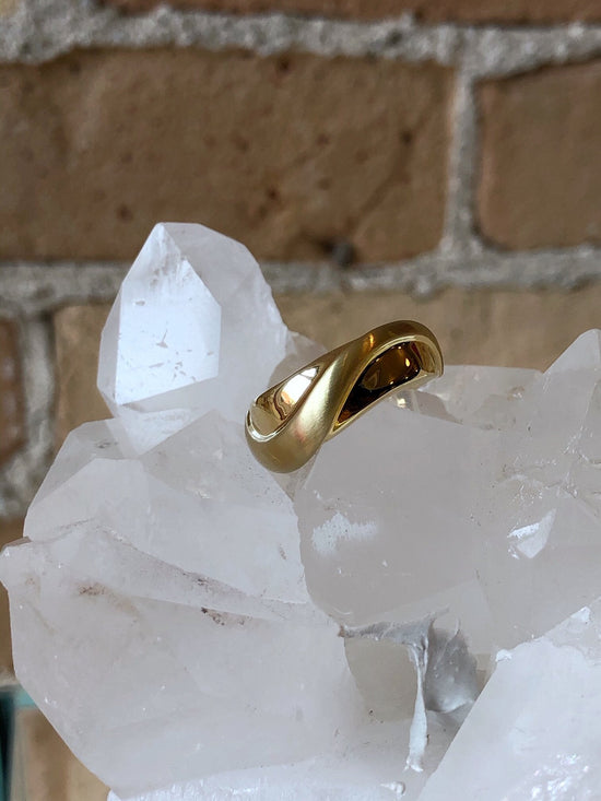 Photo of Curved Bell Ring in a decorative scene, designed by , available at Plumb Gold & Plumb Silver