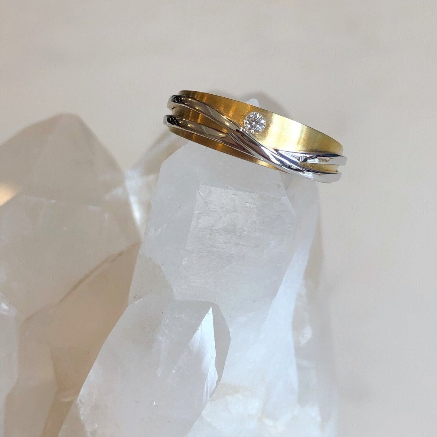 Photo of Curvy Line Ring in a decorative scene, designed by , available at Plumb Gold & Plumb Silver