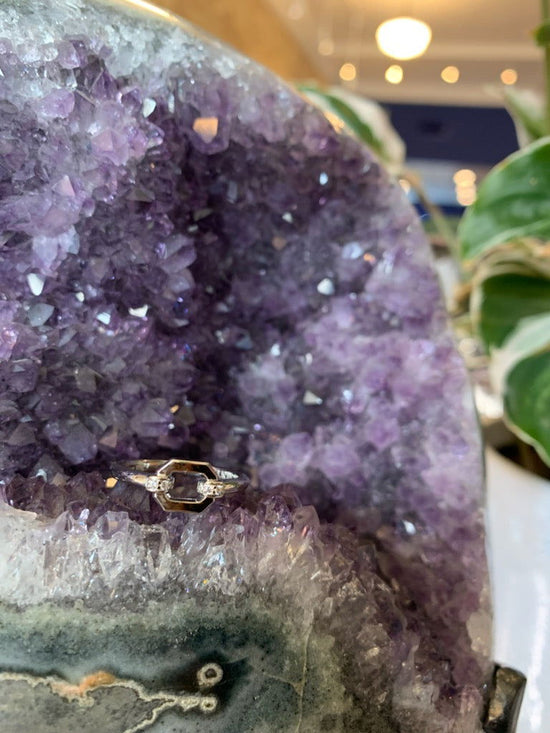 Load image into Gallery viewer, Photo of Cz Link ring in a decorative scene, designed by , available at Plumb Gold &amp;amp; Plumb Silver
