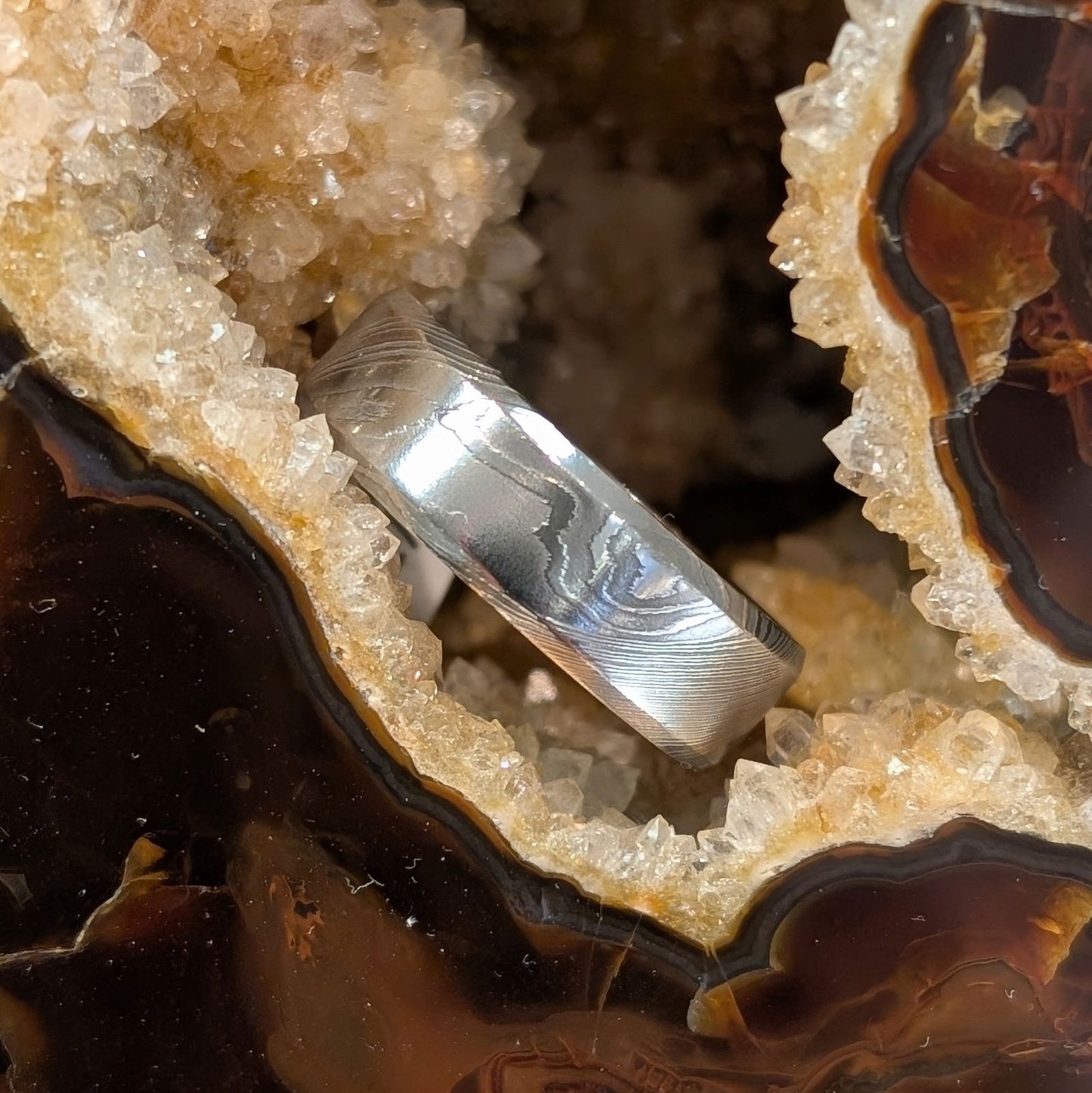 Photo of Damascus Band in a decorative scene, designed by -, available at Plumb Gold & Plumb Silver