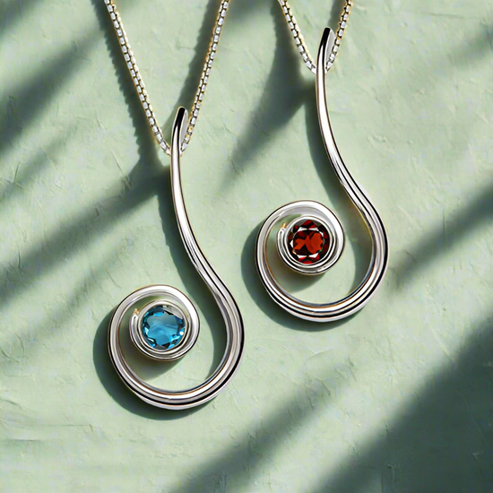 Photo of "Dancing Clef" Necklace in a decorative scene, designed by , available at Plumb Gold & Plumb Silver