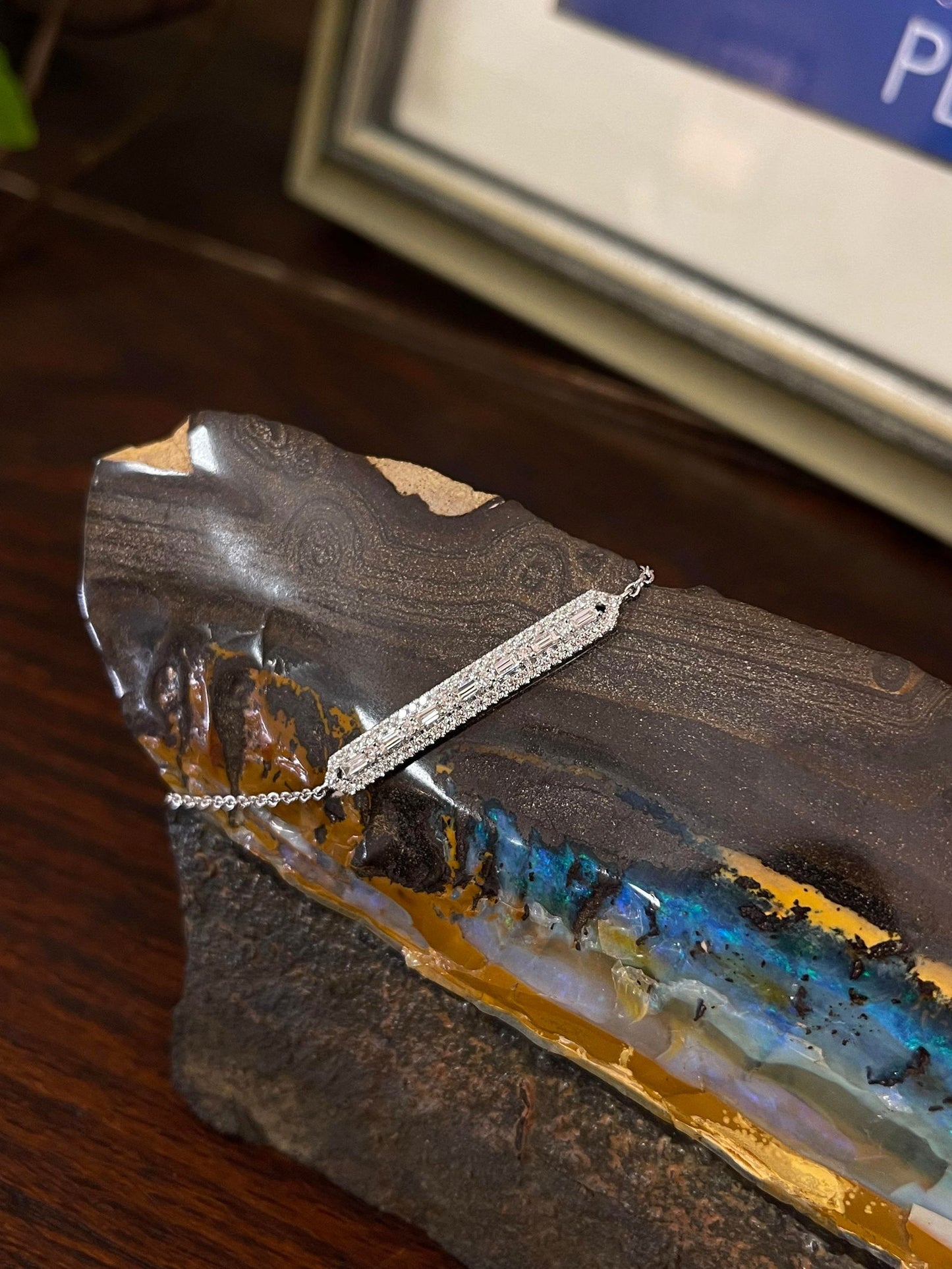 Photo of Diamond Bar Bracelet in a decorative scene, designed by , available at Plumb Gold & Plumb Silver