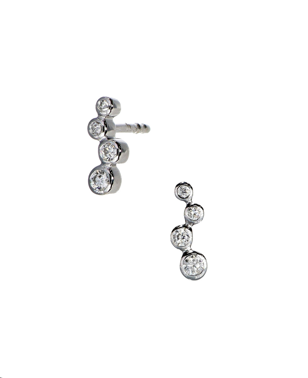 Photo of Diamond Bubbles Studs in a decorative scene, designed by , available at Plumb Gold & Plumb Silver