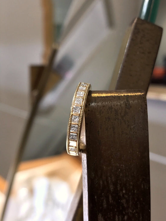 Photo of Diamond Channel Band in a decorative scene, designed by , available at Plumb Gold & Plumb Silver