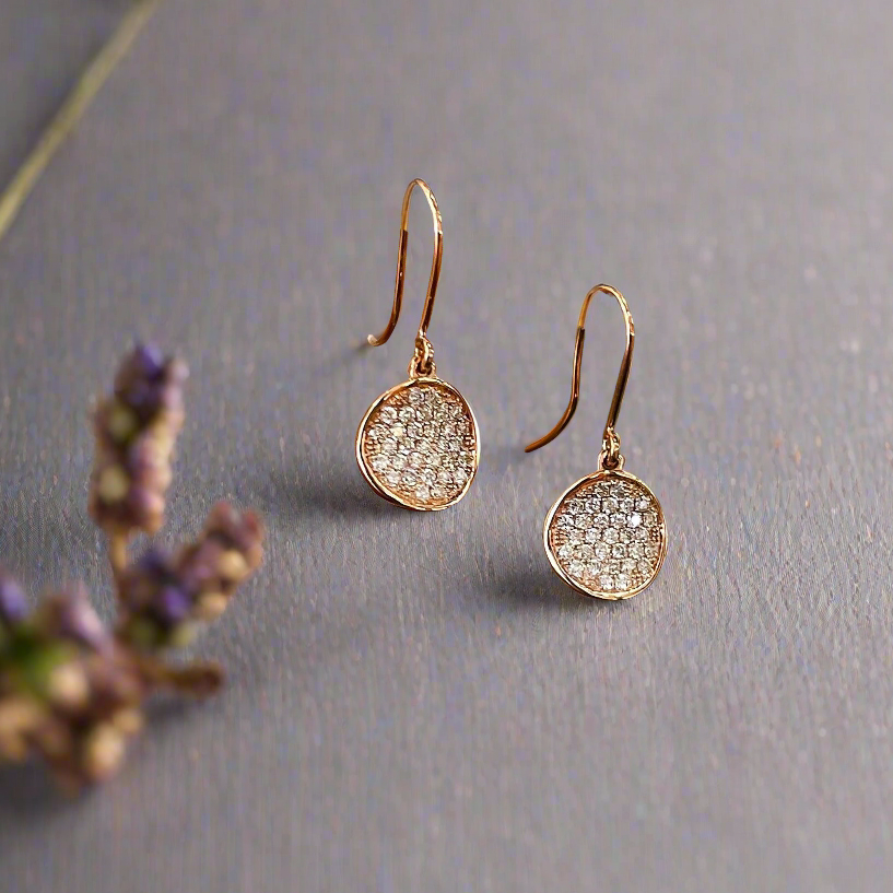 Photo of Diamond Disk Dangles in a decorative scene, designed by , available at Plumb Gold & Plumb Silver