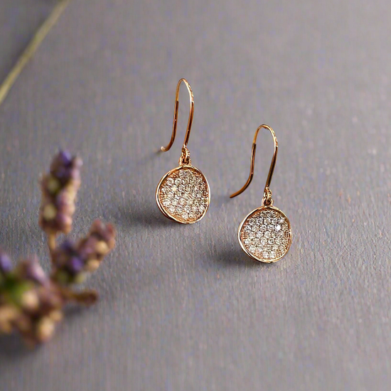 Photo of Diamond Disk Dangles in a decorative scene, designed by , available at Plumb Gold & Plumb Silver