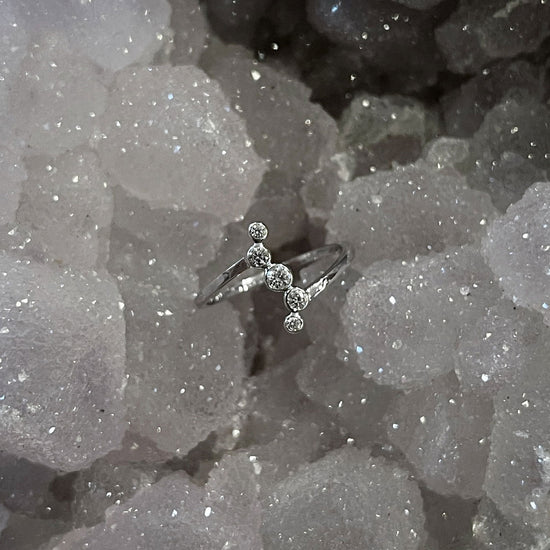 Photo of Diamond Ring in a decorative scene, designed by , available at Plumb Gold & Plumb Silver
