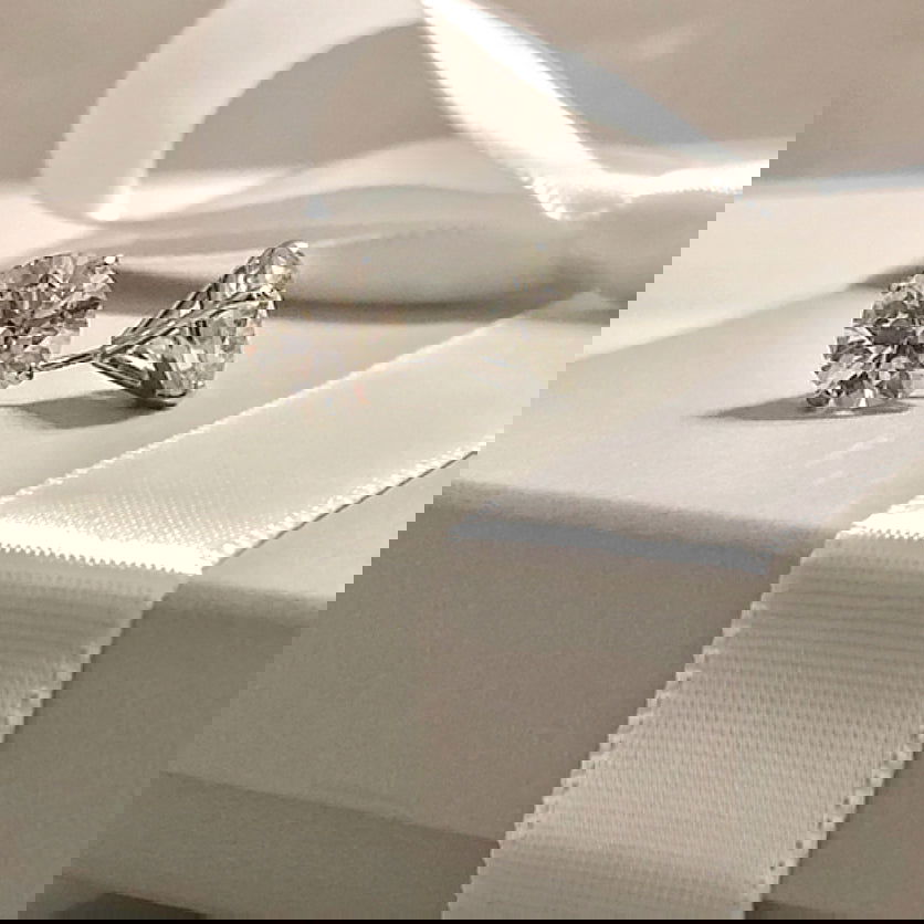 Photo of Diamond Studs in a decorative scene, designed by , available at Plumb Gold & Plumb Silver