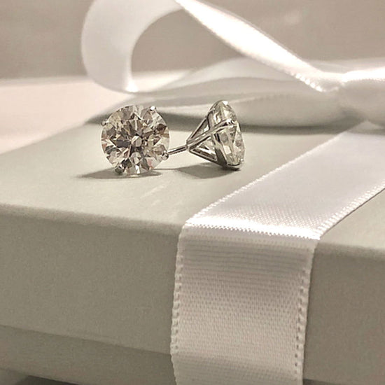 Photo of Diamond Studs in a decorative scene, designed by , available at Plumb Gold & Plumb Silver