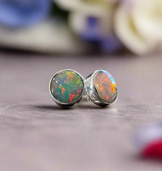 Photo of Dowdy Opal Stud Earrings in a decorative scene, designed by , available at Plumb Gold & Plumb Silver