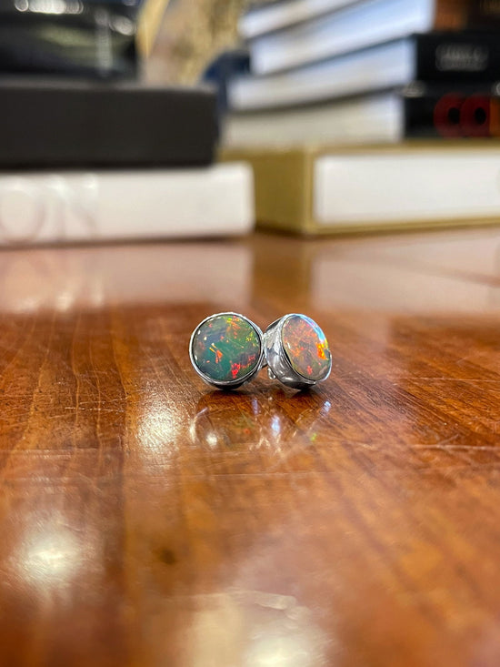 Photo of Dowdy Opal Stud Earrings in a decorative scene, designed by , available at Plumb Gold & Plumb Silver