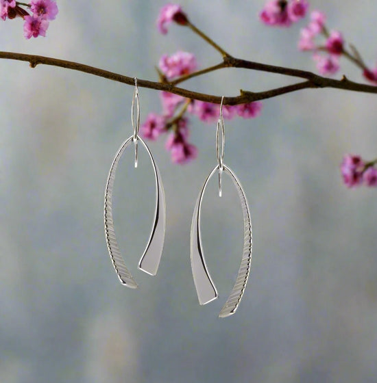 Photo of "Duet" Earrings in a decorative scene, designed by , available at Plumb Gold & Plumb Silver