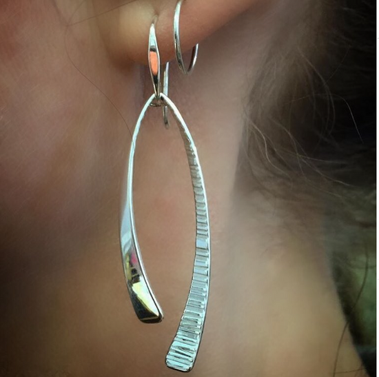 Photo of "Duet" Earrings in a decorative scene, designed by , available at Plumb Gold & Plumb Silver