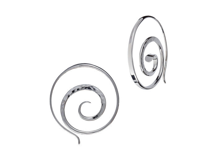 Photo of E L Designs "Crop Circle" Spiral Sterling Silver Hoop Earrings in a decorative scene, designed by , available at Plumb Gold & Plumb Silver