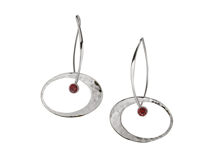 Photo of "Elliptical Elegance" Earrings in a decorative scene, designed by , available at Plumb Gold & Plumb Silver