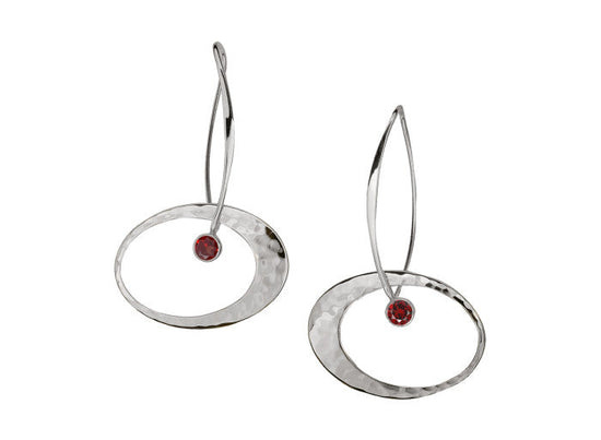 Photo of "Elliptical Elegance" Earrings in a decorative scene, designed by , available at Plumb Gold & Plumb Silver