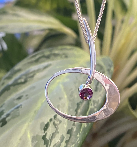 Photo of "Elliptical Elegance" Necklace in a decorative scene, designed by , available at Plumb Gold & Plumb Silver