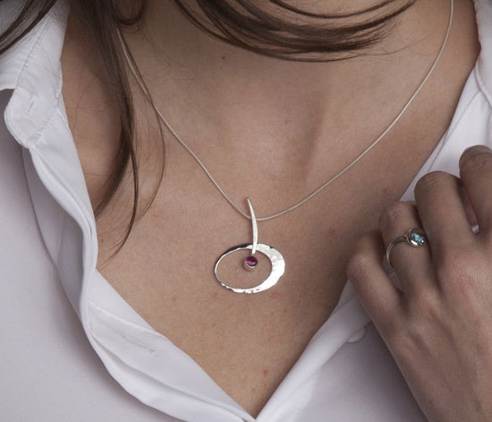Photo of "Elliptical Elegance" Necklace in a decorative scene, designed by , available at Plumb Gold & Plumb Silver