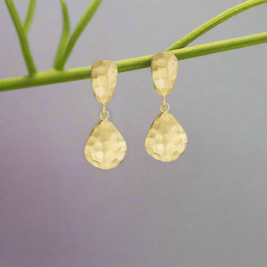 Photo of "Essential" Drop Earrings in a decorative scene, designed by -, available at Plumb Gold & Plumb Silver