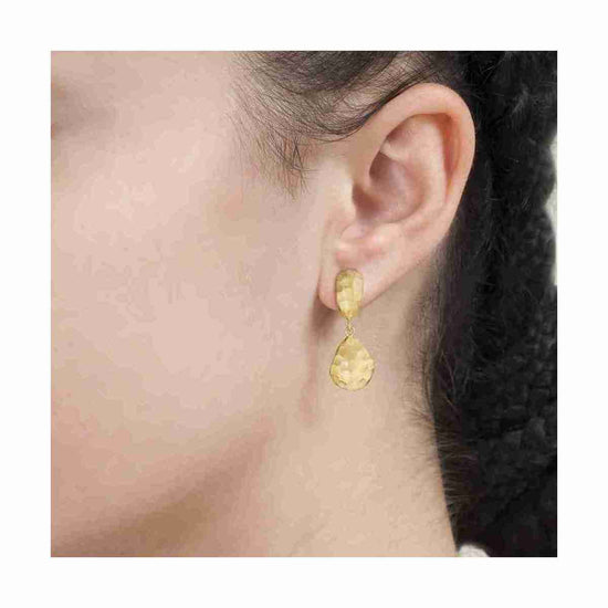 Photo of "Essential" Drop Earrings in a decorative scene, designed by -, available at Plumb Gold & Plumb Silver