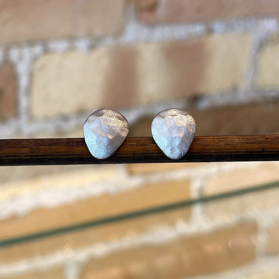 Photo of “Essential” Studs in a decorative scene, designed by , available at Plumb Gold & Plumb Silver