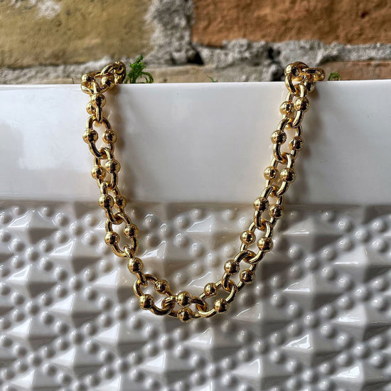 Load image into Gallery viewer, Photo of Fancy Link Chain in a decorative scene, designed by , available at Plumb Gold &amp;amp; Plumb Silver
