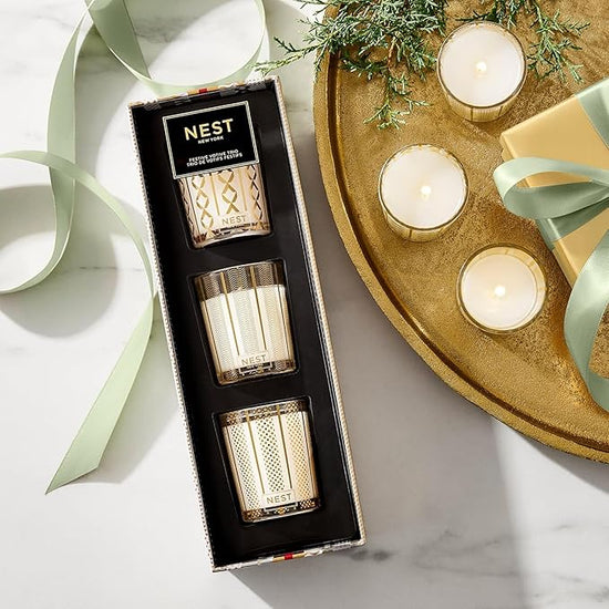 Photo of Festive Votive Candle Trio in a decorative scene, designed by , available at Plumb Gold & Plumb Silver
