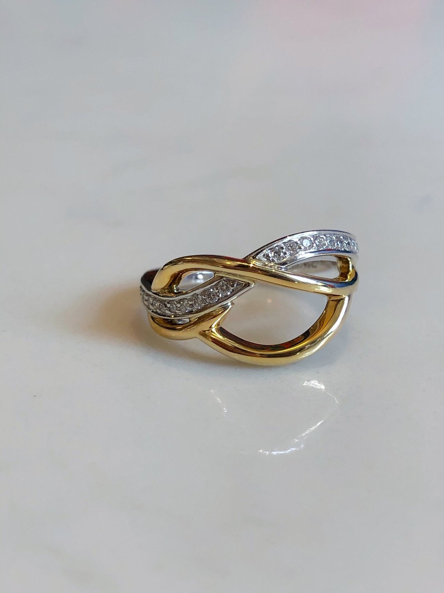 Photo of Free Form Ring in a decorative scene, designed by , available at Plumb Gold & Plumb Silver
