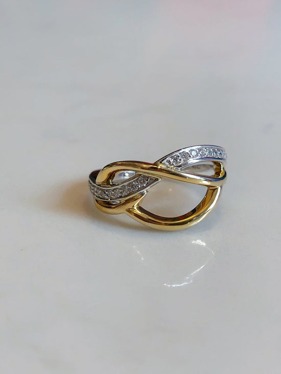 Photo of Free Form Ring in a decorative scene, designed by , available at Plumb Gold & Plumb Silver