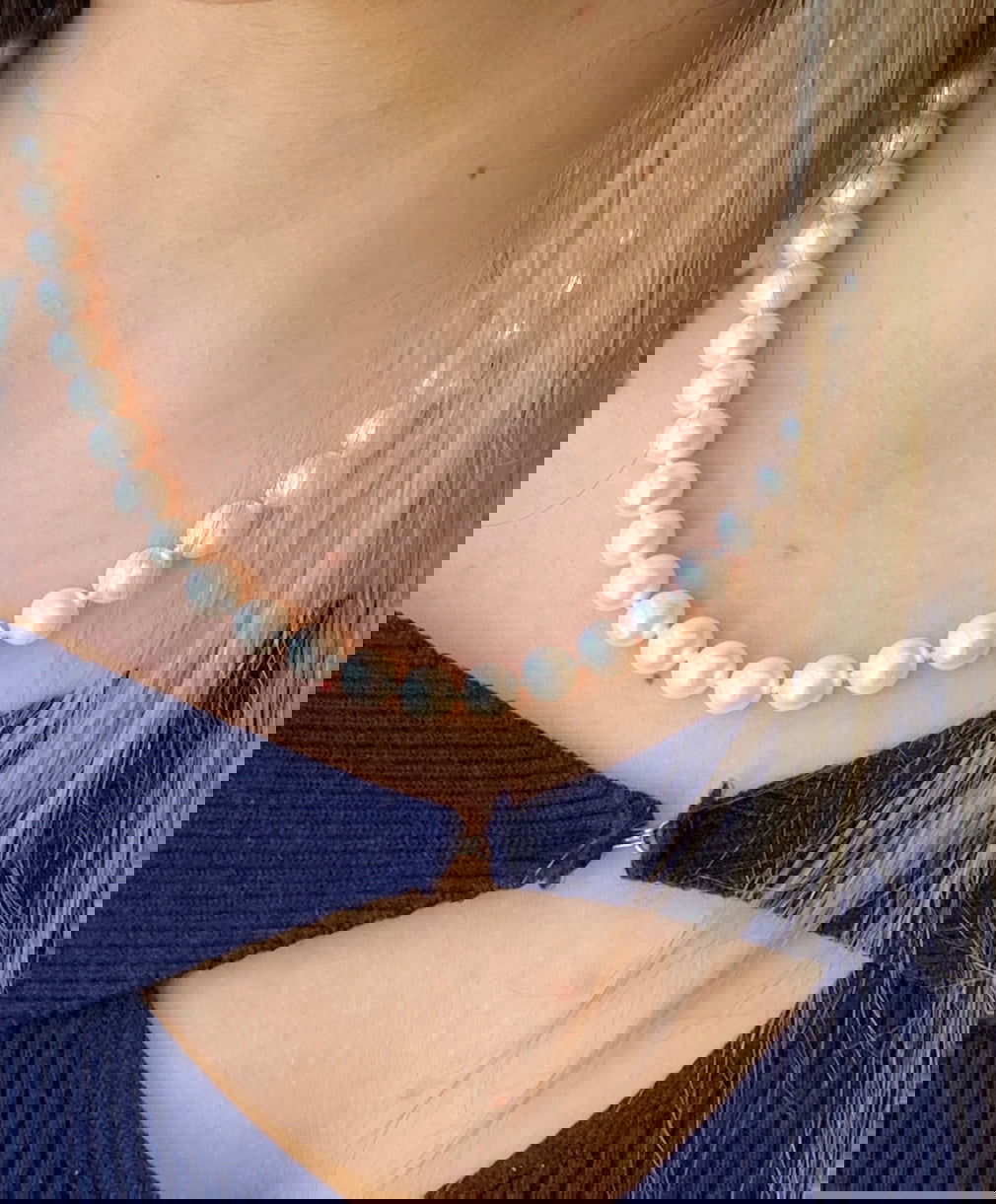 Photo of Freshwater Pearl Necklace in a decorative scene, designed by , available at Plumb Gold & Plumb Silver