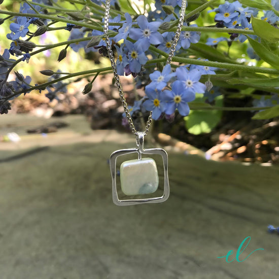 Photo of Freshwater Pearl "Zenith" Necklace in a decorative scene, designed by , available at Plumb Gold & Plumb Silver