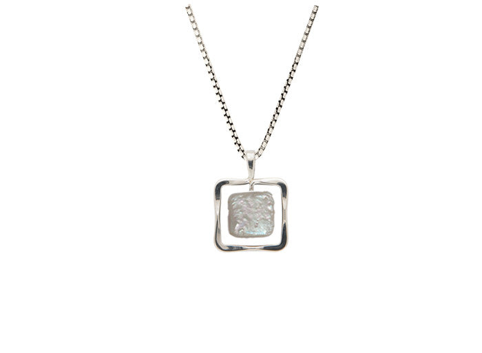 Photo of Freshwater Pearl "Zenith" Necklace in a decorative scene, designed by , available at Plumb Gold & Plumb Silver
