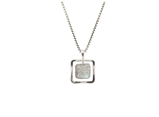 Photo of Freshwater Pearl "Zenith" Necklace in a decorative scene, designed by , available at Plumb Gold & Plumb Silver
