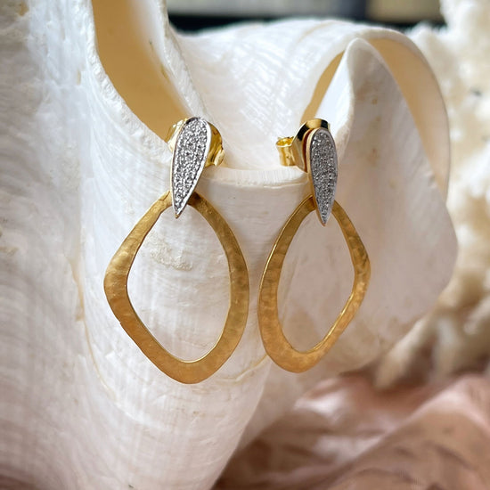 Photo of Gallery Dangles in a decorative scene, designed by , available at Plumb Gold & Plumb Silver