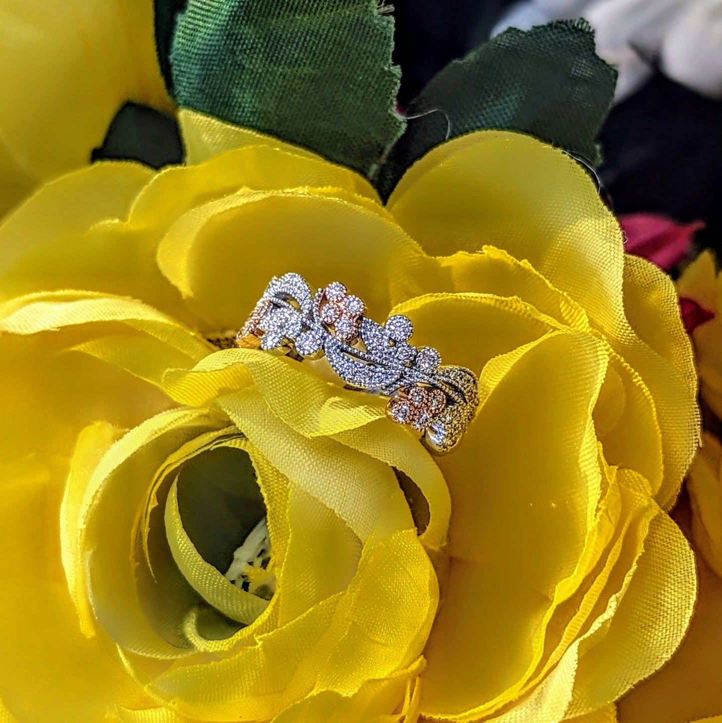 Photo of "Gardenia" Rose Gold Accent Band in a decorative scene, designed by , available at Plumb Gold & Plumb Silver