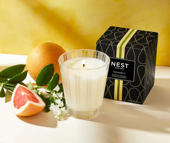 Photo of Grapefruit Candle in a decorative scene, designed by , available at Plumb Gold & Plumb Silver