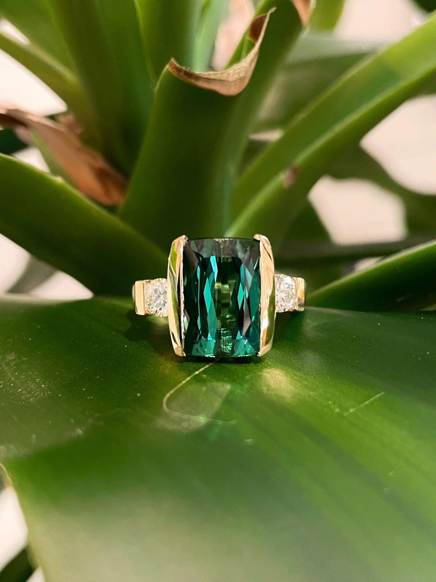 Photo of Green Tourmaline Ring in a decorative scene, designed by , available at Plumb Gold & Plumb Silver