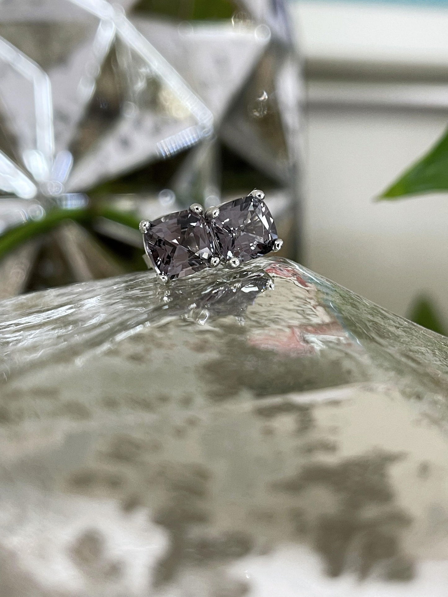 Photo of Grey Spinel Studs in a decorative scene, designed by , available at Plumb Gold & Plumb Silver