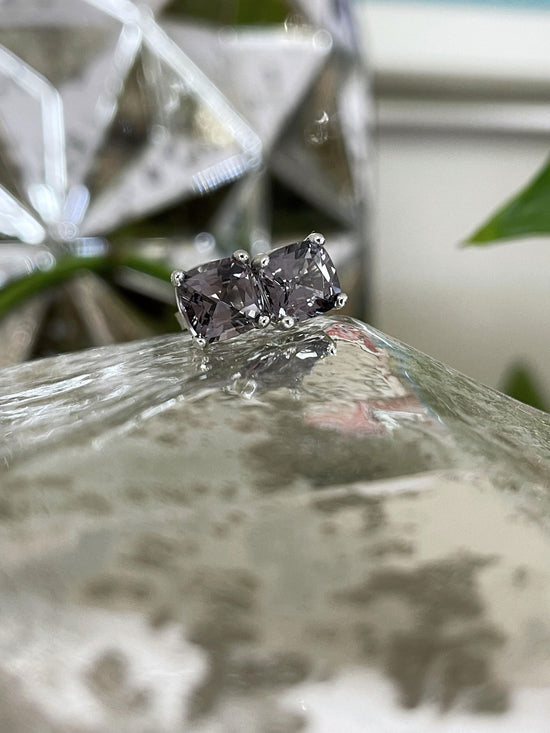 Photo of Grey Spinel Studs in a decorative scene, designed by , available at Plumb Gold & Plumb Silver