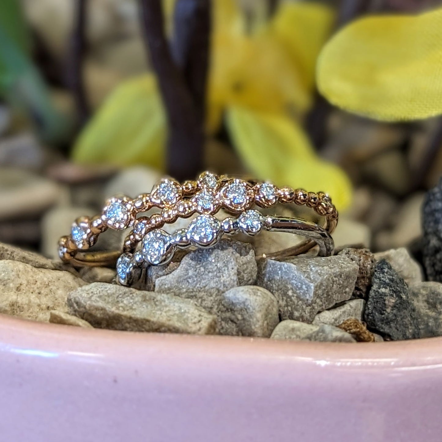 Photo of "Gypsy" Beaded Diamond Band in a decorative scene, designed by , available at Plumb Gold & Plumb Silver