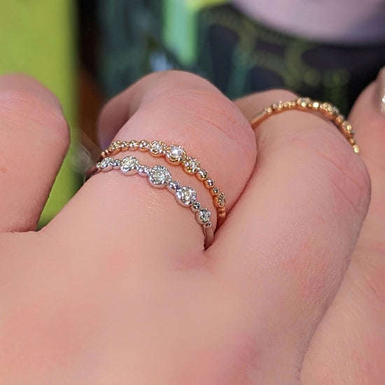 Photo of "Gypsy" Beaded Diamond Band in a decorative scene, designed by , available at Plumb Gold & Plumb Silver