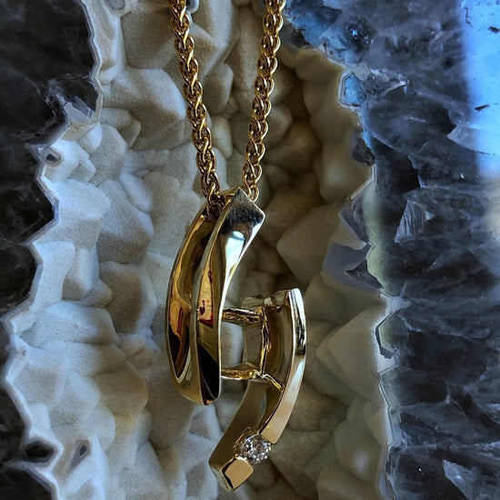 Photo of HL Designs Diamond Ellipse in a decorative scene, designed by , available at Plumb Gold & Plumb Silver