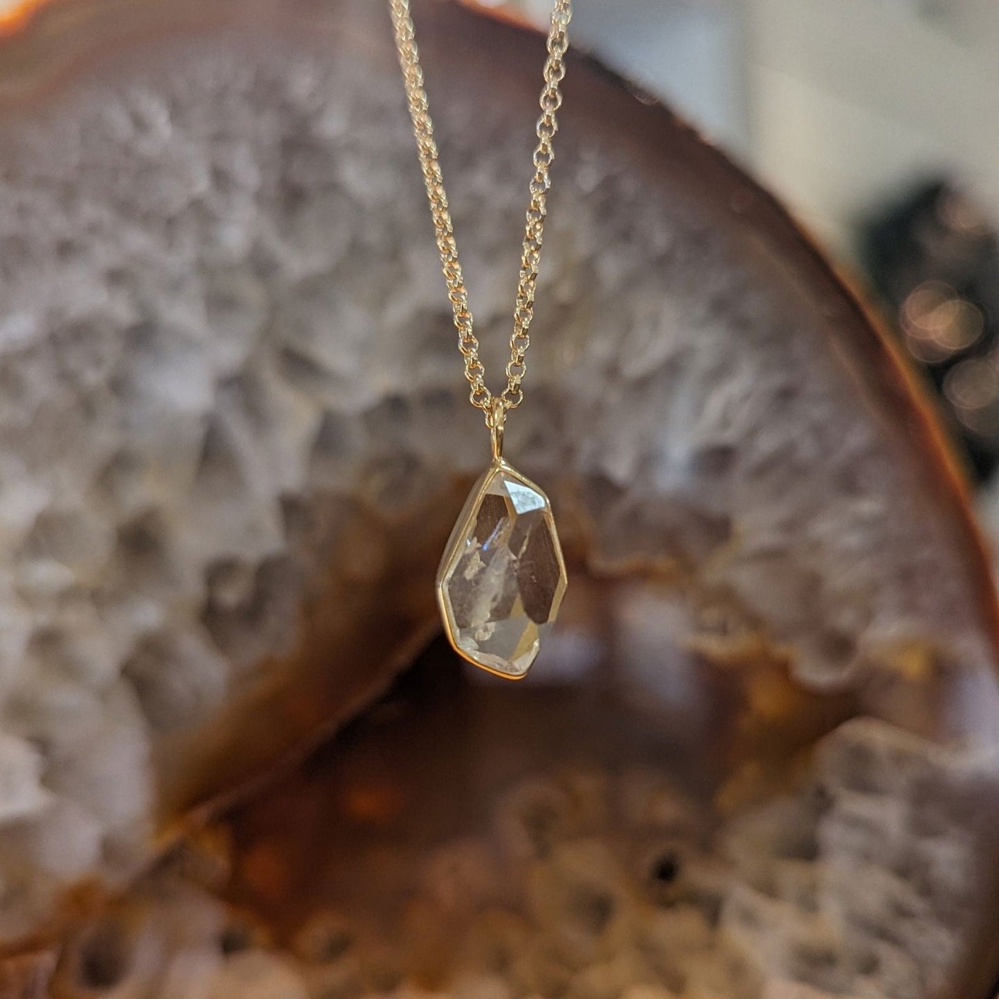 Photo of "Herkimer" Pendant in a decorative scene, designed by , available at Plumb Gold & Plumb Silver