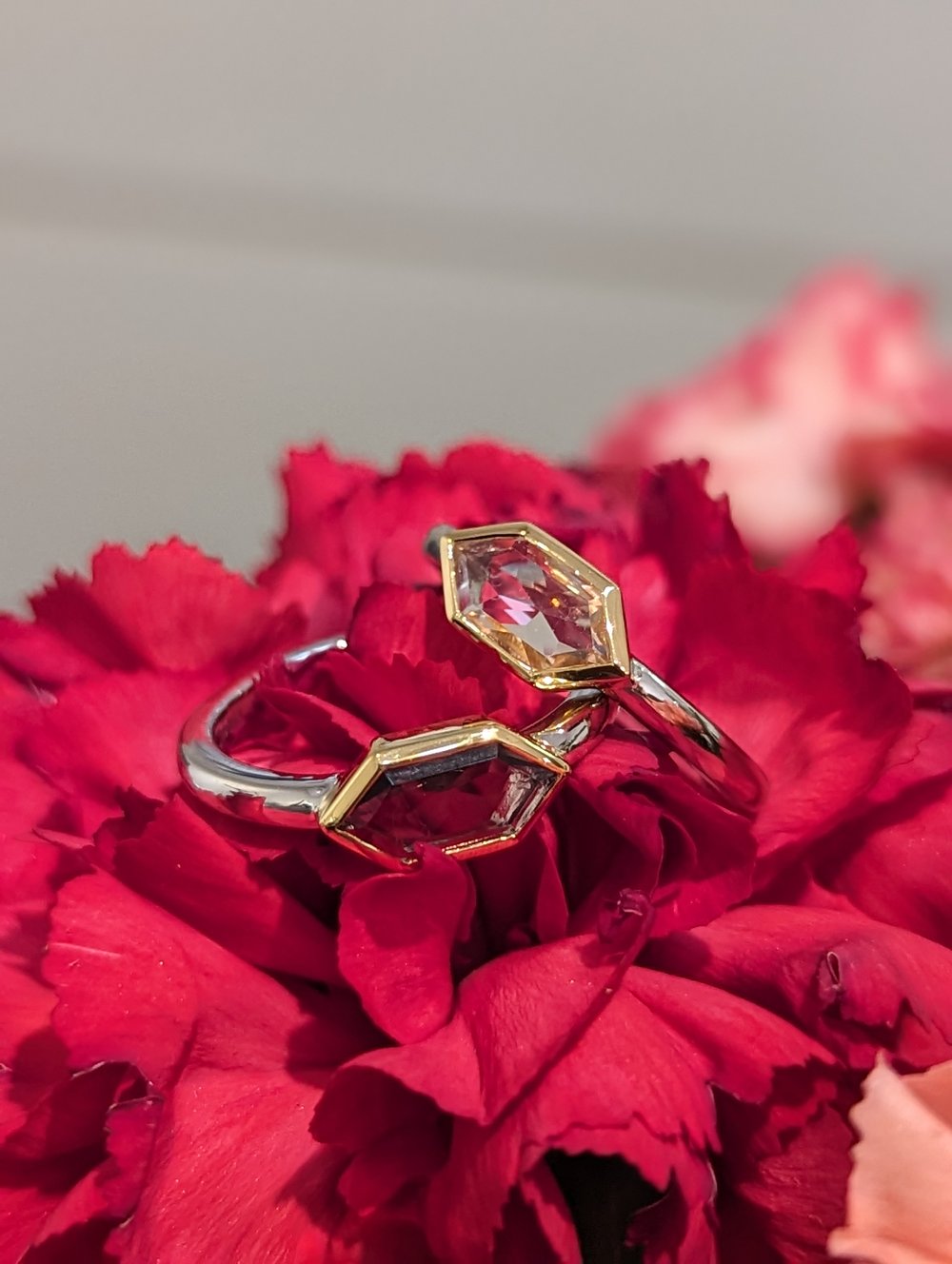 Photo of Hexagon Bezel Ring in a decorative scene, designed by , available at Plumb Gold & Plumb Silver