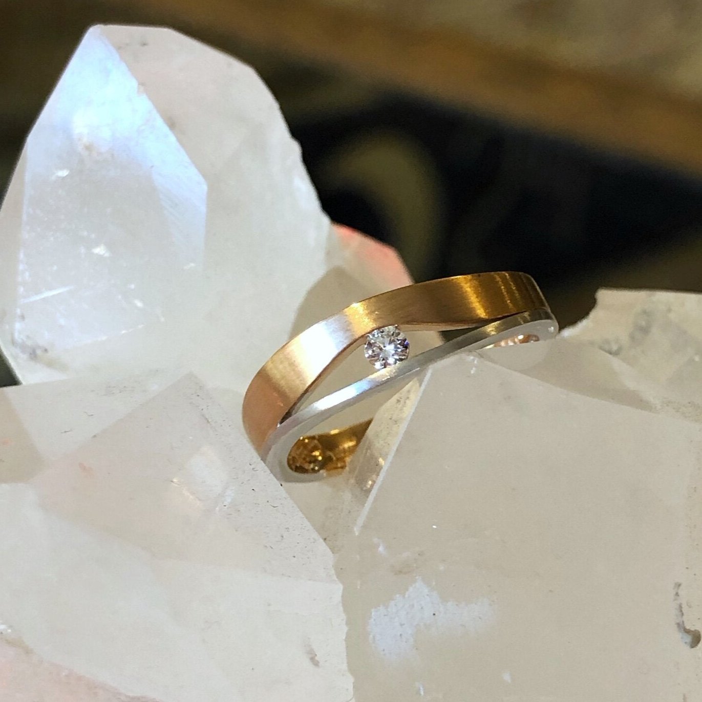 Photo of Hidden Diamond Fashion Band in a decorative scene, designed by , available at Plumb Gold & Plumb Silver